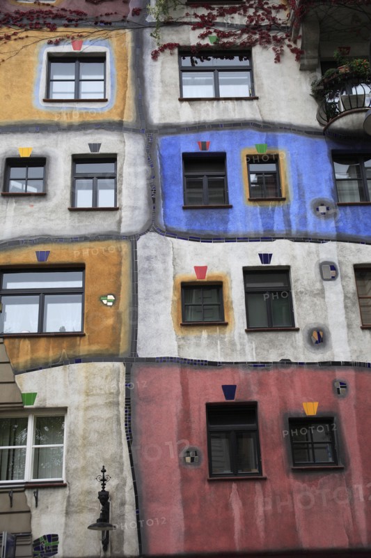 Vienna, Austria. Hundertwasswerhaus moderm colourful expressionist apartment building exterior. Austria Austrian Vienna Wien Viennese Republic Austro-Bavarian Wean Europe European City Capital Travel Destination Hundertwasswer Haus Hundertwasswerhaus Modern Architecture Exterior Facade Colourful Colorful Expressionist Expressionism Distorted Destination Destinations Flat Osterreich Viena Western Europe
