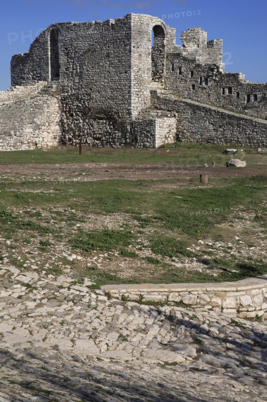 Berat, Albania. Castle ruined stone fortifications. Albanian Shqip‘ria Southern Europe Albania Albanian Republic Europe European Travel Destination Indo European Berat Castle Fort Fortified Fortifications Stone Walls Battlements Blue Castillo Castello Color Destination Destinations Gray History Historic