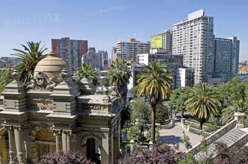 Santiago, Chile. The classical lines of the Neptune Terrace at the Cerro Santa Lucia with Chilean Palm trees and highrise apartment blocks in downtown Santiago Chile Chilean South America American Hispanic Santiago City Cityscape Urban Neptune Terrace Trees Tree Palm Santa Lucia Cerro Flats Towers Blocks Block Apartments Apartment Highrise Caribbean Destination Destinations Flat Latin America Latino South America Southern Windward Islands