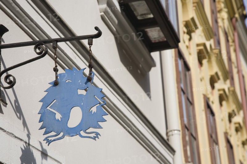 Vienna, Austria. Hanging shop sign in the shape of a hedgehog. Austria Austrian Republic Vienna Viennese Wien Europe European City Capital Architecture Shop Store Sign Hedgehog Blue Color Destination Destinations Osterreich Signs Display Posted Signage Viena Western Europe