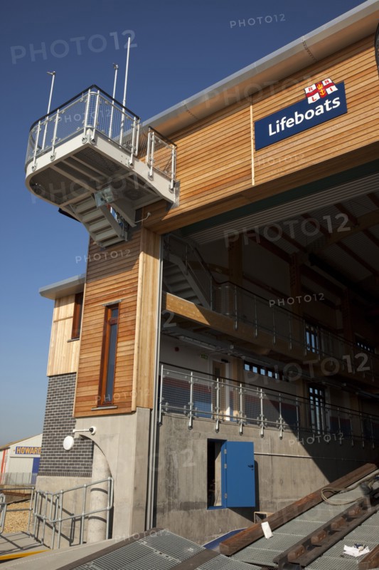 Shoreham-by-Sea, West Sussex, England. Kingston Beach Newly constructed lifeboat house opposite the harbour entrance. England English West Sussex County Shoreham Shoreham-by-Sea by Sea Water Kingston Beach Europe European Architecture Modern Life Boat Lifeboat Lifeboats RNLI Wood Wooden Clad Galvanised Metal Zinc Blue Sky Station Home Timber Frame