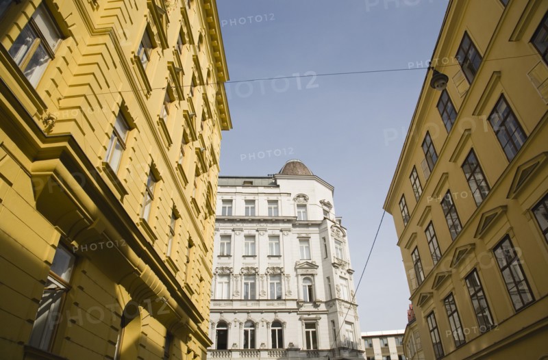 Vienna, Austria. White and yellow painted exterior facades of restored buildings. Austria Austrian Republic Vienna Viennese Wien Europe European City Capital Architecture Buildings Street Exterior Facade Yellow White Restored Renovated Color Destination Destinations Osterreich Viena Western Europe