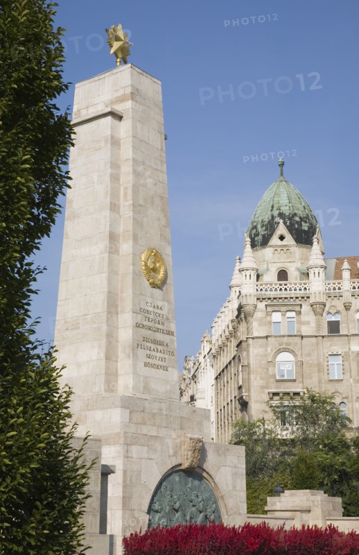Budapest, Pest County, Hungary. WWII memorial with Art Nouveau building facade behind. Hungary Hungarian Europe European East Eastern Buda Pest Budapest City Architecture Buildings WWII World War Two Memorial Art Nouveau Facade Blue Sky 2 Destination Destinations Eastern Europe History Historic