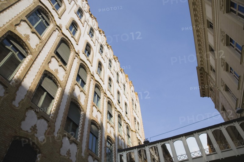 Budapest, Pest County, Hungary. Angled view of renovated apartment buildings exterior facade. Hungarian Europe European East Eastern Buda Pest Budapest City Architecture Building Apartment Block Blue Destination Destinations Eastern Europe Flat