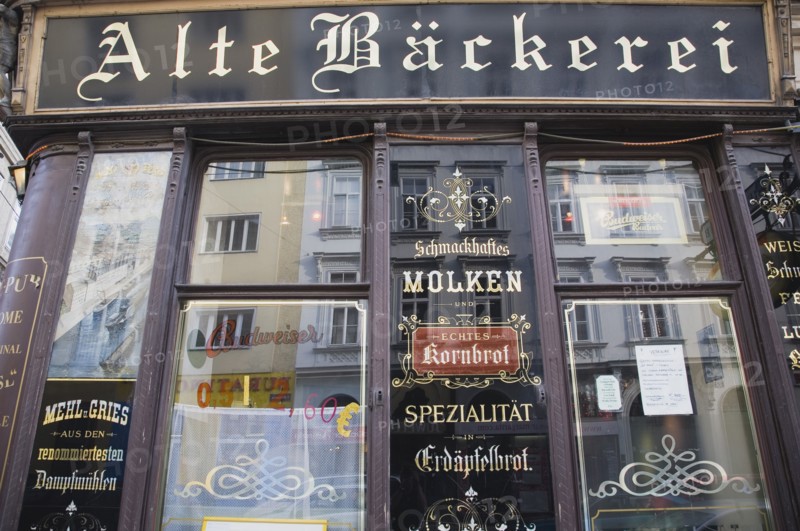 Vienna, Austria. Part view of exterior facade of restaurant with traditional signage. Austria Austrian Republic Vienna Viennese Wien Europe European City Capital Architecture Building Exterior Facade Traditional Sign Signs Sinage Restaurant Classic Classical Destination Destinations Historical Older Osterreich Signs Display Posted Signage Viena Western Europe