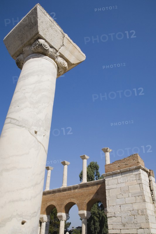 Selcuk, Izmir Province, Turkey. Partially reconstructed wall of the 6th century Basilica of St. John the Apostle with marble column in foreground. Turkey Turkish Eurasia Eurasian Europe Asia Turkiye Izmir Province Selcuk Basilica St Saint John Apostle Ruin Restored Restored Reconstructed Destination Destinations European History Historic Middle East South Eastern Europe Western Asia