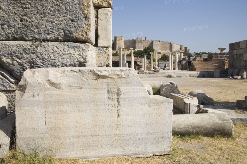 Selcuk, Izmir Province, Turkey. Ruins of the 6th century Basilica of St. John the Apostle with piece of inscribed stone and fallen masonry in foreground. Turkey Turkish Eurasia Eurasian Europe Asia Turkiye Izmir Province Selcuk St Saint John Apostle Basilica Ruin Ruins Destination Destinations European History Historic Middle East South Eastern Europe Western Asia