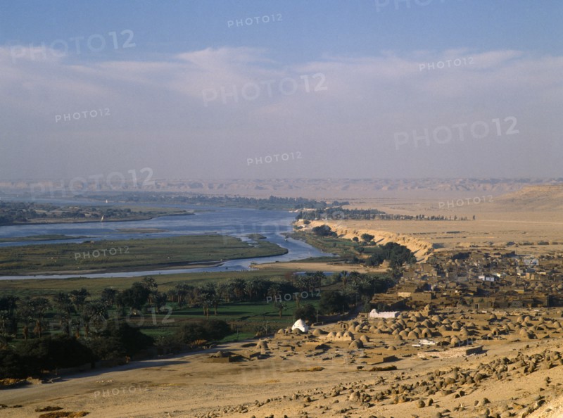 Beni Hasan, Nile Valley, Egypt. View over Muslim cemetery toward the River Nile African Islam Middle East Moslem North Africa Religion Religion Religious Muslims Islam Islamic