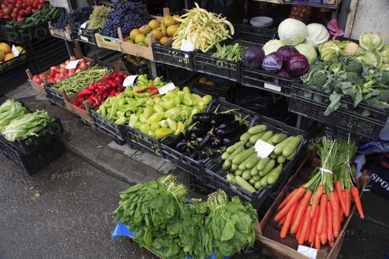 Albania, Tirane, Tirana, Display of fruit and vegetables at grocers stall in the Avni Rustemi Market including aubergines  cabbage and carrots.