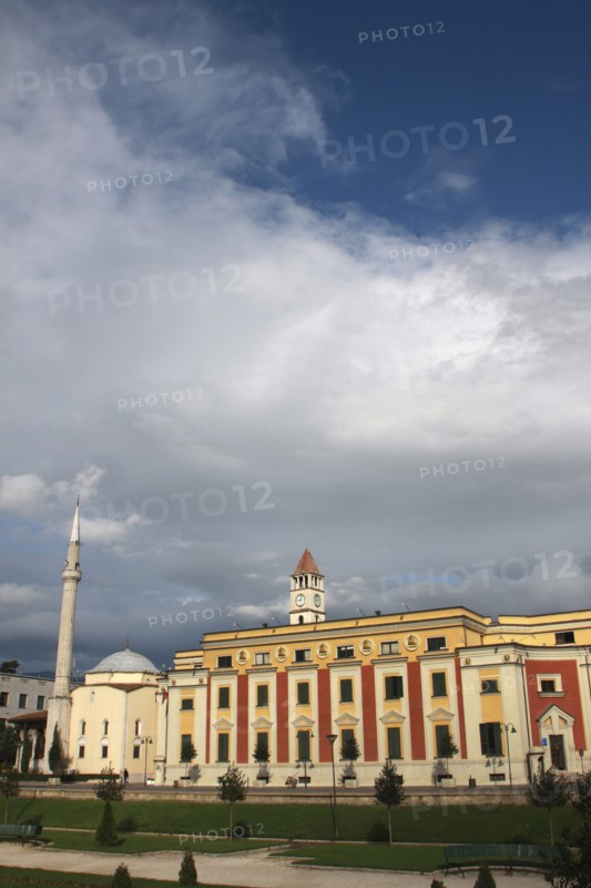 Albania, Tirane, Tirana, Exterior facade of government buildings and Ethem Bey Mosque on Skanderbeg Square.