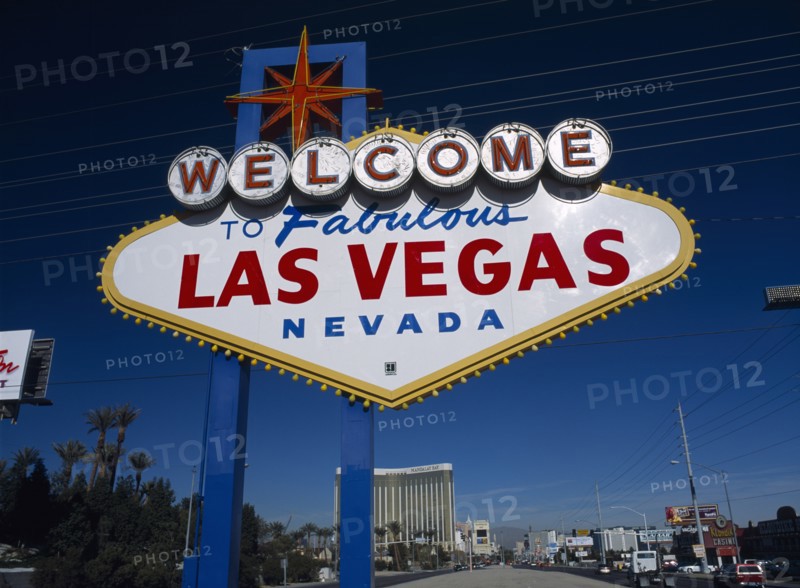 USA, Nevada, Las Vegas, Welcome to fabulous Las Vegas sign with the Mandalay hotel behind on Las Vegas Boulevard south.