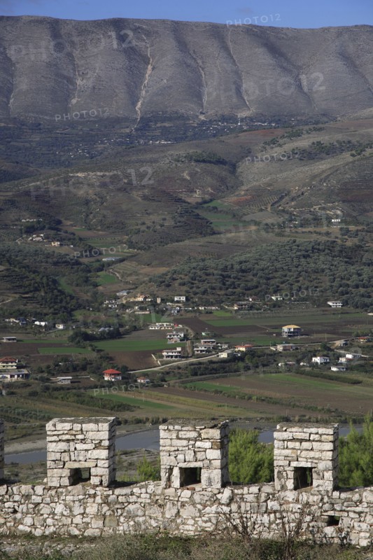 Albania, , Crenellated battlements of ancient castle with cannons with view across landscape beyond.