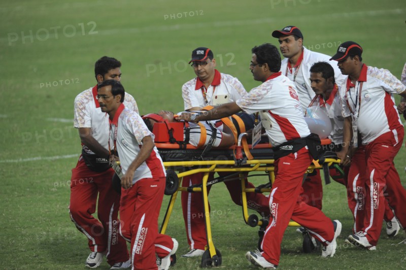 India, Delhi, 2010 Commonwealth games  Rugby game  injured player being taken off the pitch on wheeled stretcher.