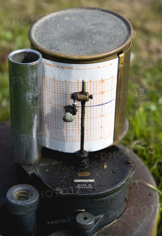 Climate, Weather, Measurements, Tipping Bucket Rain Gauge Recorder with ink pen marking duration of rainfall on graph paper attached to the drum at the Bognor Regis Weather Station.