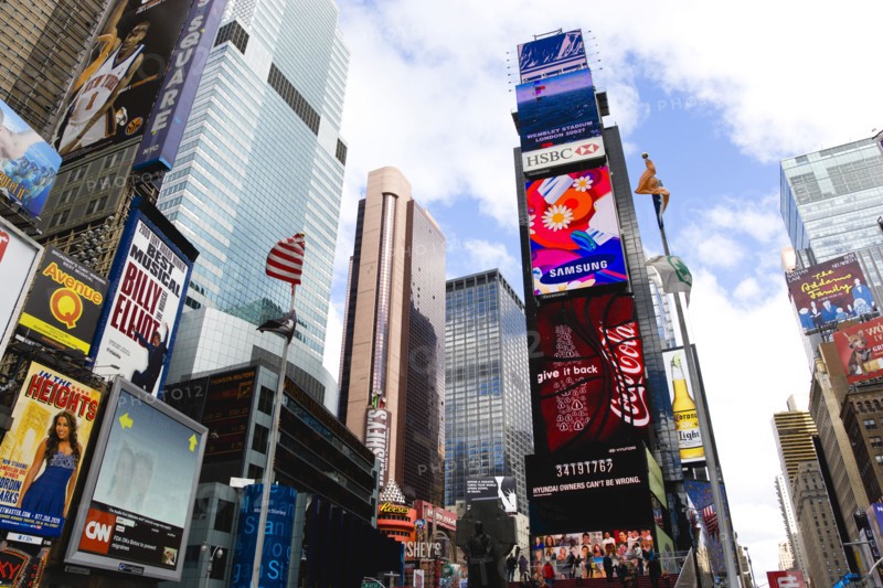 USA, New York, New York City, Manhattan  Times Square at the junction of 7th Avenue and Broadway below buildings with advertising on large video screens.