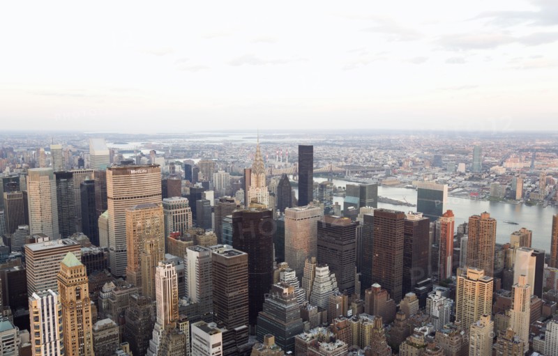 USA, New York, New York City, Manhattan  View from Empire State building over midtown skyscrapers and East River towards Queens and Long Island.