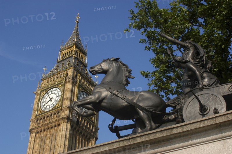 England, London, Westminster, Angled view looking up at Big Ben clock tower with the Boadicea statue in the foreground
