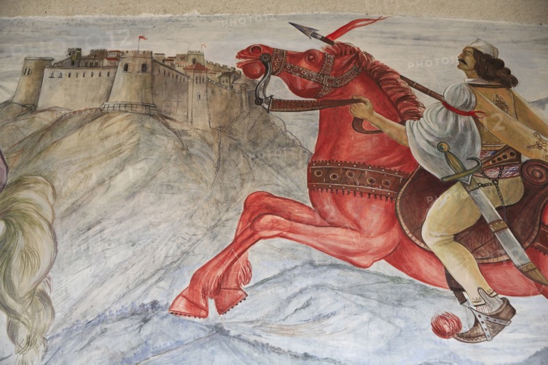 Albania, Kruja, Mural on the wall of the National Skanderbeg Museum depicting battle scene.