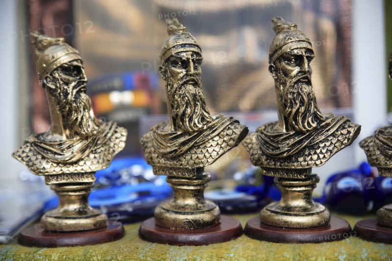 Albania, Kruja, Souvenirs displayed for sale on stalls in the market bazaar in the old town.