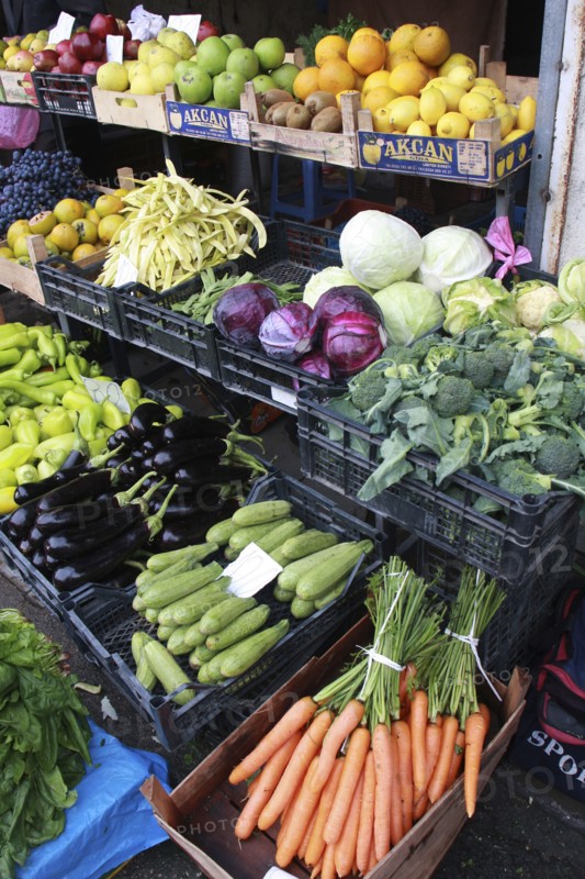 Albania, Tirane, Tirana, Display of fruit and vegetables including aubergines  carrots and cabbage at grocers in the Avni Rustemi market.