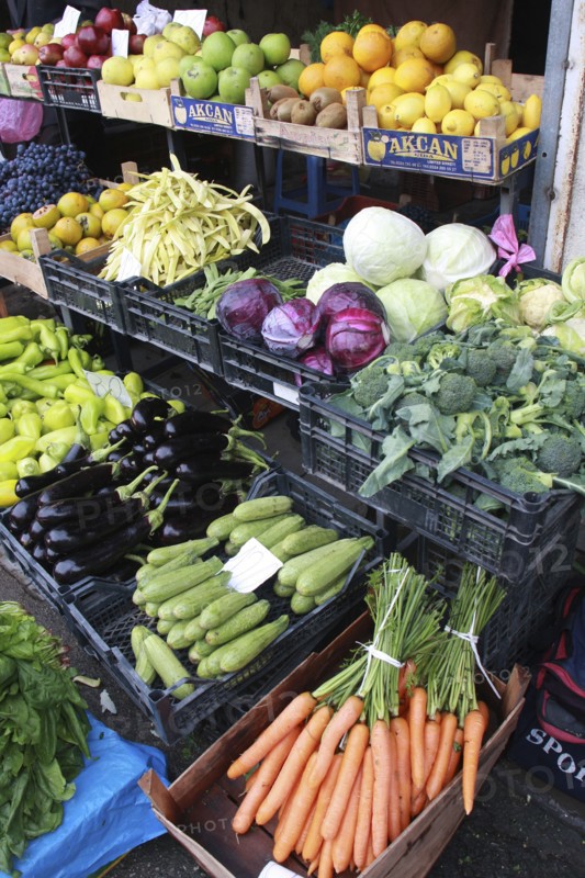 Albania, Tirane, Tirana, Display of fruit and vegetables including carrots  aubergine and cabbage at grocers shop in the Avni Rustemi market.