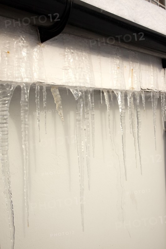 Weather, Winter, Ice, Large Icicles hanging from roof eaves.