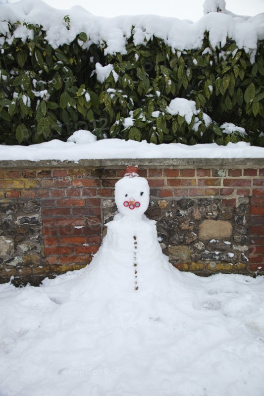 Weather, Winter, Snow, Snowman made against wall.