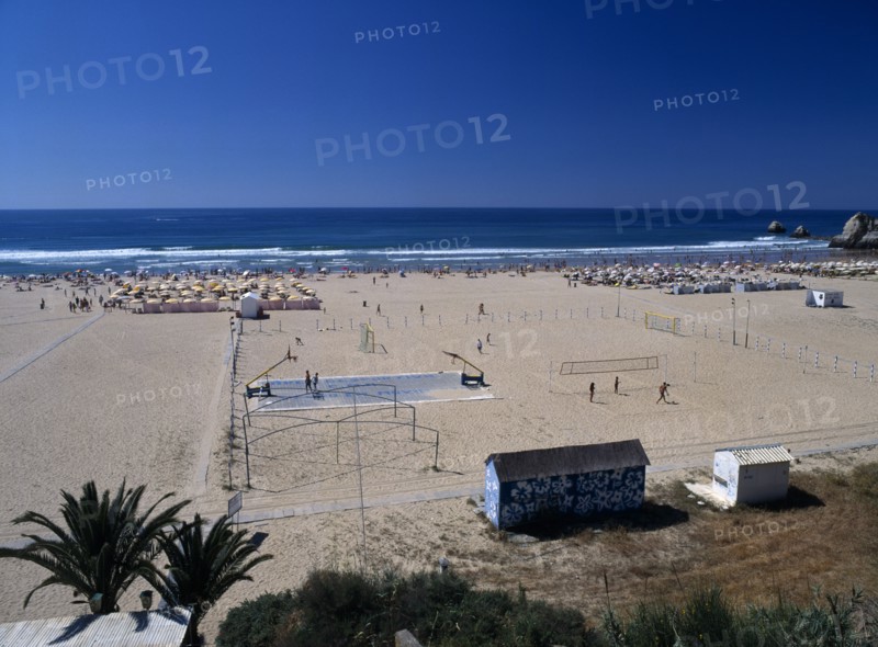 Portugal, Algarve, Praia da Rocha, View along beach with basketball & volleyball play areas