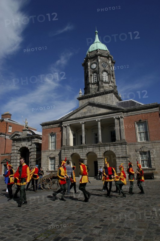 Ireland, Dublin, Performers wearing jester cotumes dancing in the Upper Yard of Dublin Castle