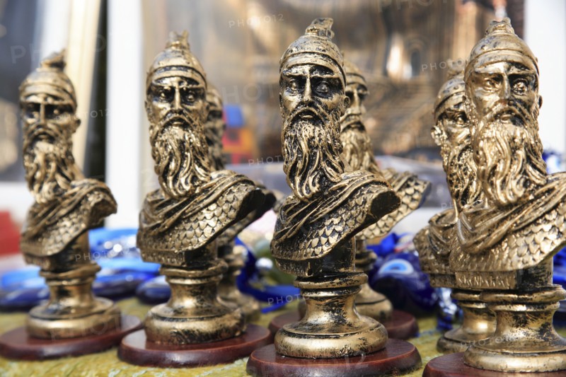 Albania, Kruja, Souvenirs displayed for sale on stalls in the market bazaar in the old town.