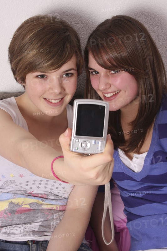 Children, Teenagers, Girls, Two teenage girls taking a photo of themselves.