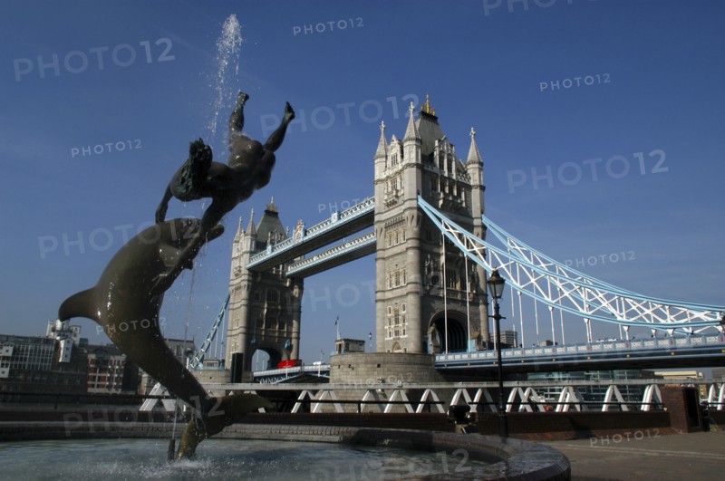 England, London, Tower Bridge with sculpted fountain in the foreground