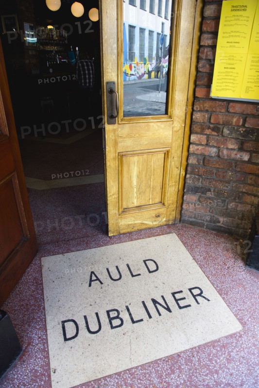 Ireland, County Dublin, Dublin City, Entrance door to the Auld Dubliner pub in Temple Bar with the name written on the ground.