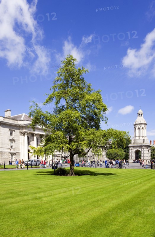 Ireland, County Dublin, Dublin City, Trinity College university with people walking through Parliament Square towards the Campanile.