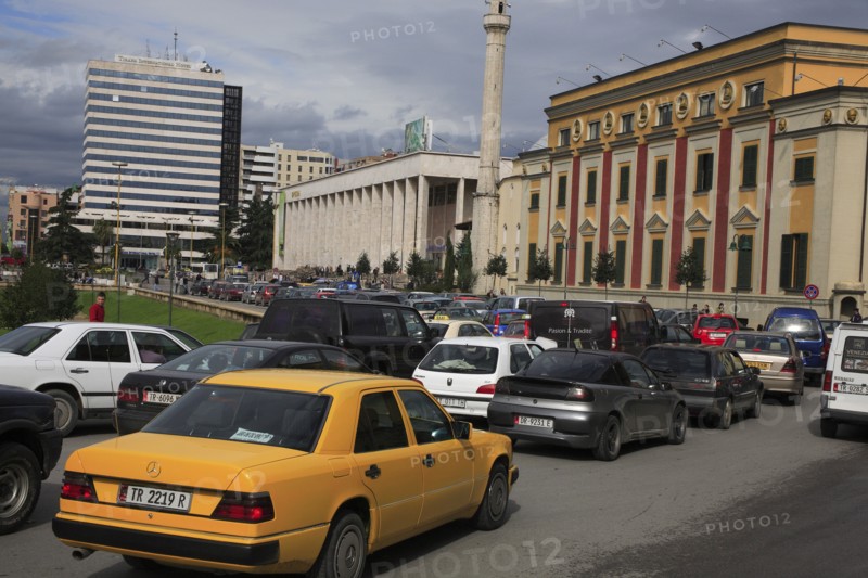 Albania, Tirane, Tirana, Congested traffic in front of the Opera House  Ethem Bey Mosque and government buildings on Skanderbeg Square.