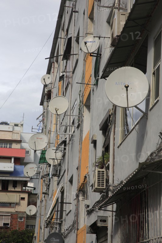 Albania, Tirane, Tirana, Satellite dishes on apartment building.