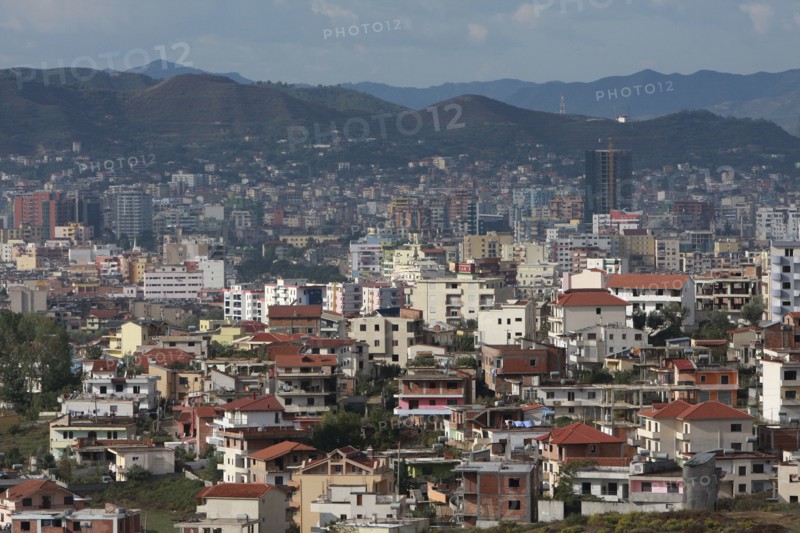 Albania, Tirane, Tirana, View across residential buildings to the hillside beyond.