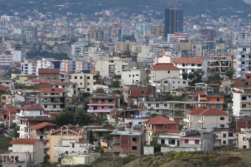 Albania, Tirane, Tirana, View across residential buildings to the hillside beyond.