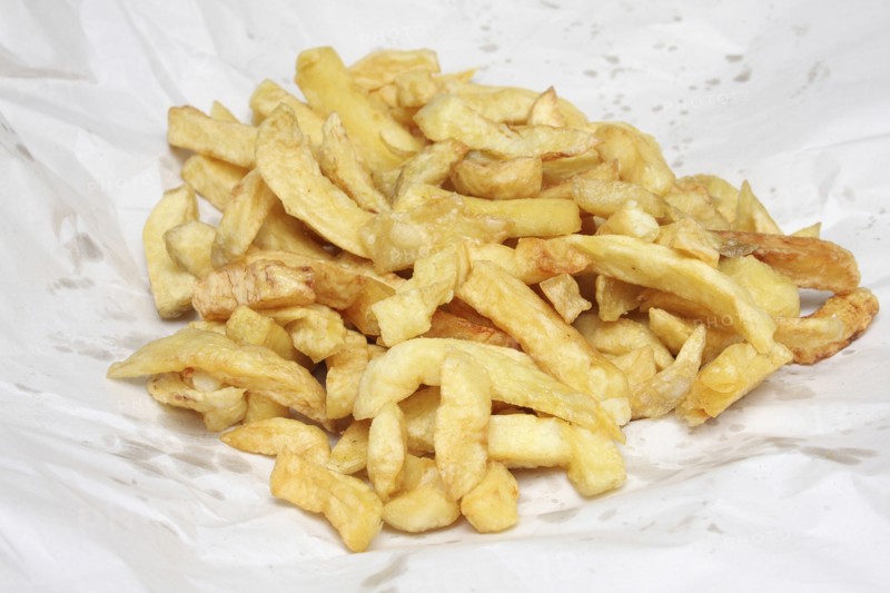 Food, Fast Food, Fish and Chips, Portion of deep fried chips from Fish and Chip shop  still in their paper wrapping.