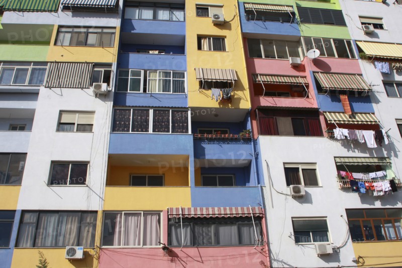 Albania, Tirane, Tirana, Part view of multi coloured apartment block exterior facade.