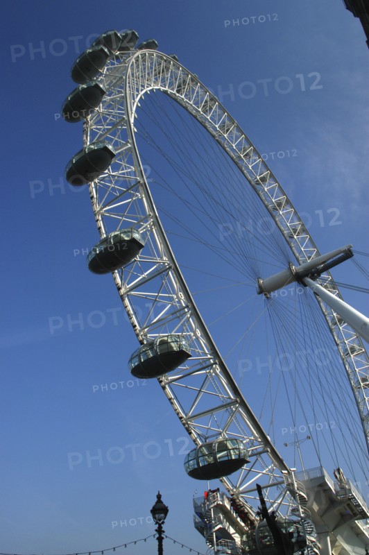 England, London, British Airways London Eye seen from below against a blue sky
