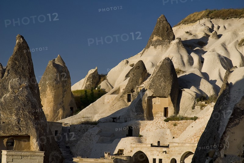 Peaked rooftops of cave dwellings set into volcanic tufa of hillside. Photo: Hugh Rooney