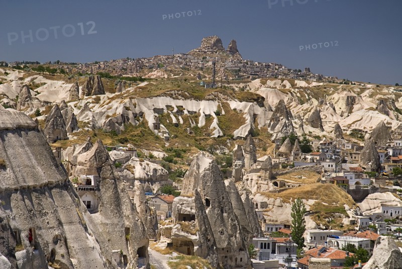 Cave hotel in foreground with view across volcanic tufa landscape towards hilltop town of Uchisar. Photo : Hugh Rooney