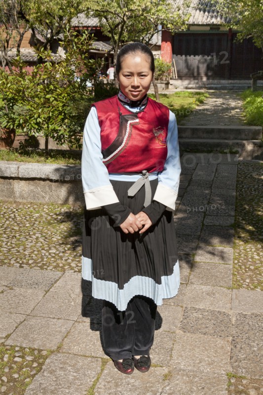 Young Naxi woman wearing traditional costume. Photo: Mel Longhurst