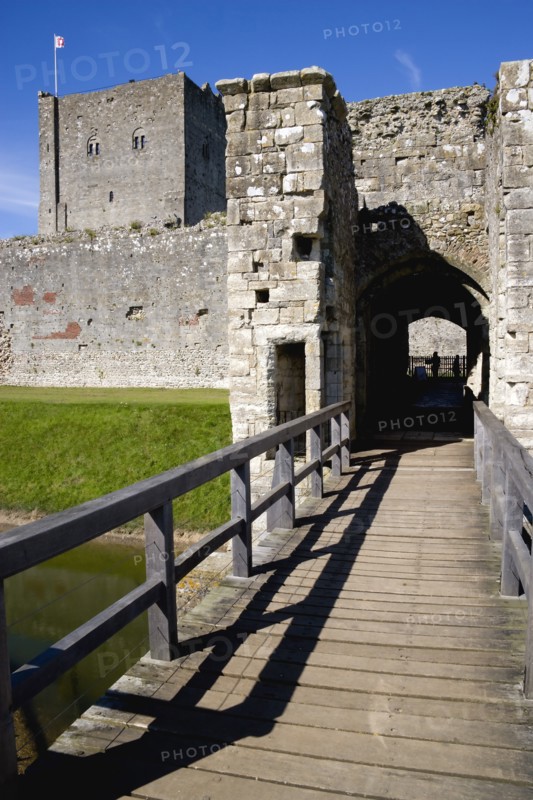 Portchester Castle showing the Norman 12th Century Tower and 14th Century Keep beyond the bridge over the moat built within the Roman 3rd Century Saxon Shore Fort. Photo: Paul Seheult