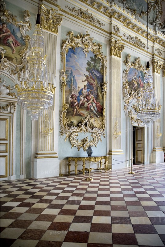 Nymphenburg Palace. Interior of Steinerner Saal the Stone or Great Hall with detail of paintings red and white chequered floor and gold and white baroque decoration by Francois de Cuvillies. Photo : Hugh Rooney