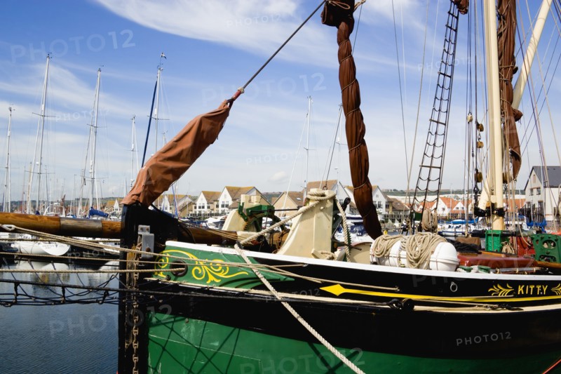 Port Solent Sailing barge SB Kitty moored in the marina with housing beyond. Photo: Paul Seheult