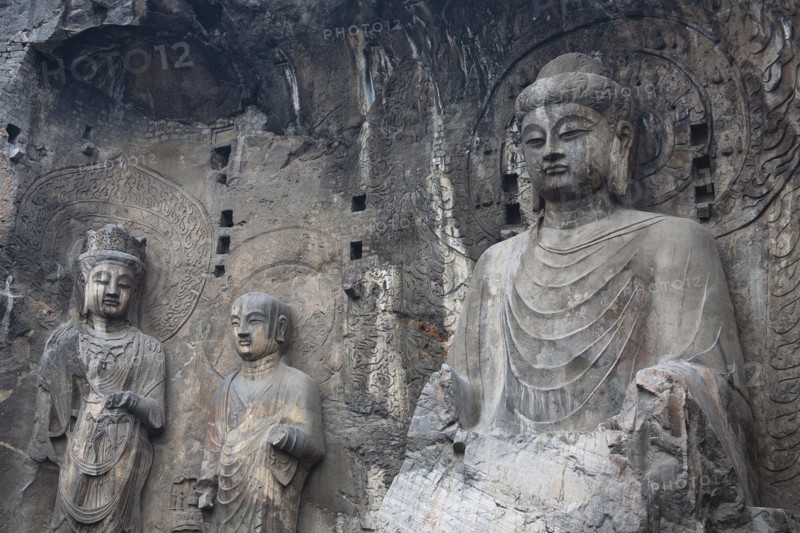Carved Buddhist statues Fengxian Temple Tang Dynasty Longmen Grottoes and Caves. Photo: Mel Longhurst