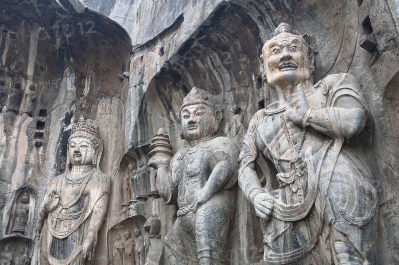 Carved Buddhist statues Fengxian Temple Tang Dynasty Longmen Grottoes and Caves. Photo: Mel Longhurst