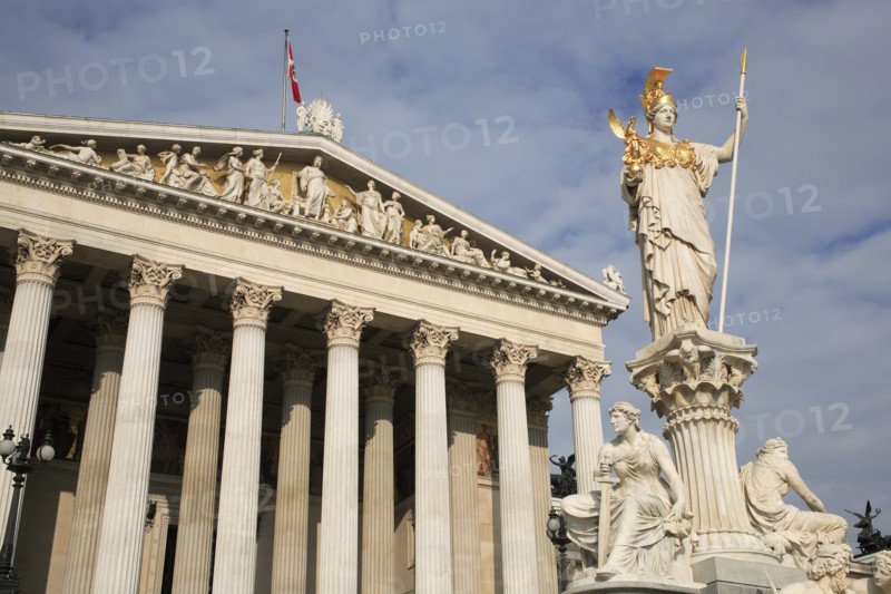 Statue of Athena set on pillar rising above fountain in front of Parliament building. Photo : Bennett Dean